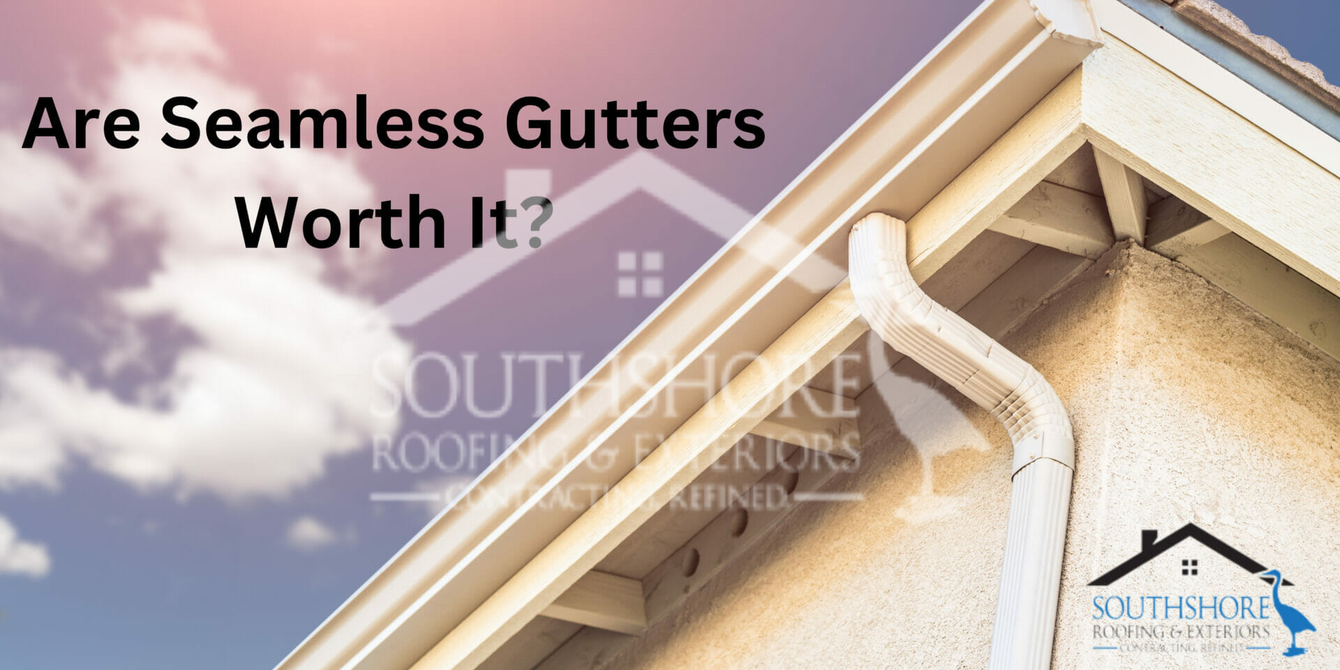 White seamless gutters on house roof with cloudy sky background