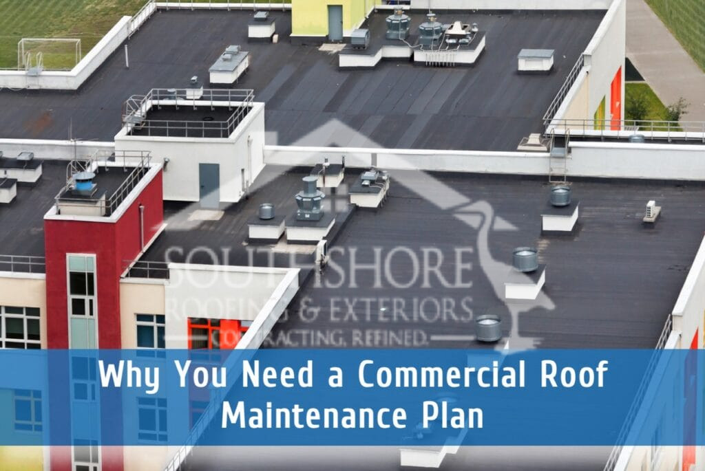 Aerial view of commercial building rooftop with HVAC systems and maintenance equipment